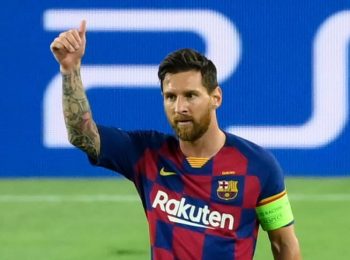 Messi agrees to stay at Barcelona on reduced wages deal